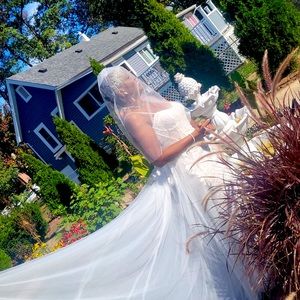 Wore once in Oct/22. Off white, silver crown and veil